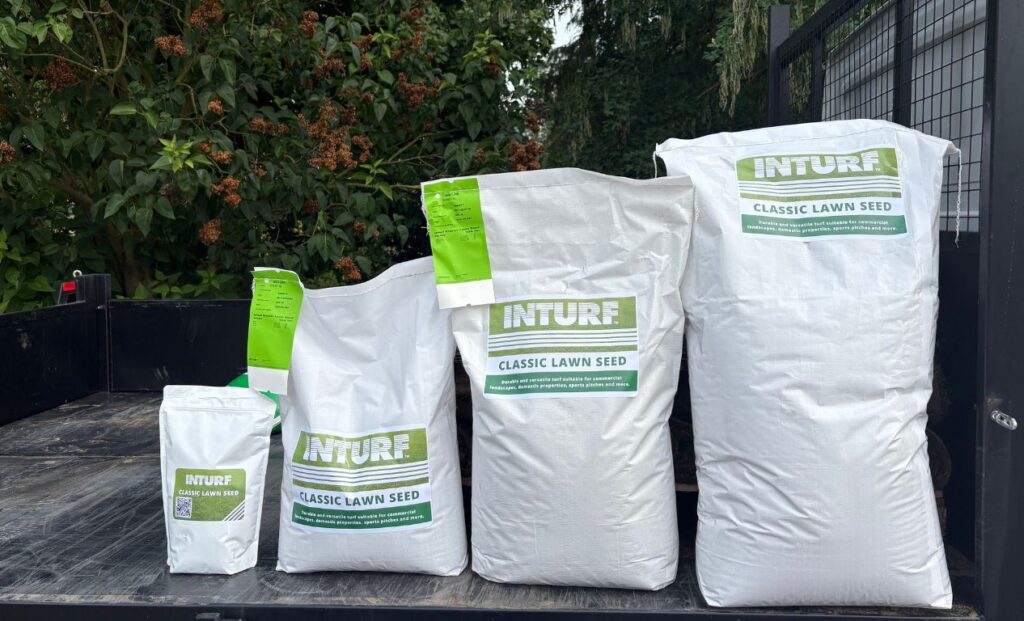 4 bags of varing heights lined up with the label 'Inturf classic lawn seed' on them.